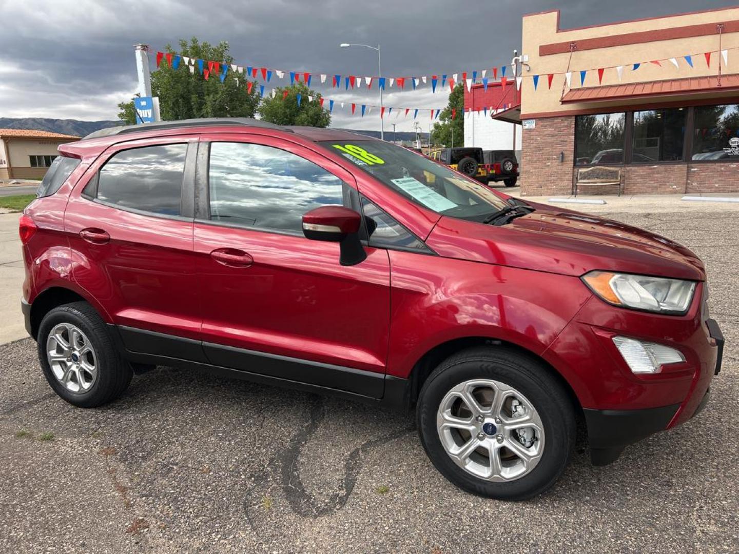 2018 red Ford Ecosport SE (MAJ6P1ULXJC) with an 4 Cyl, 2.0L engine, Automatic transmission, located at 3030 CY Ave, Casper, WY, 82604, (307) 265-3830, 42.827816, -106.357483 - Discover the perfect blend of versatility and efficiency with our 2018 Ford EcoSport SE, now available at our dealership. This compact SUV comes equipped with a reliable 4WD system, ensuring confident handling in various driving conditions. Under the hood, you'll find a responsive 4 Cyl, 2.0L engine - Photo#3