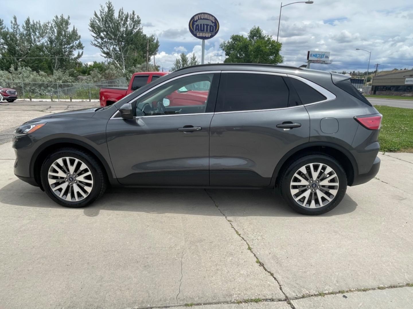 2020 GRAY /Tan FORD ESCAPE TITANIUM (1FMCU9J98LU) with an 2.0L engine, Automatic transmission, located at 3030 CY Ave, Casper, WY, 82604, (307) 265-3830, 42.827816, -106.357483 - Photo#0