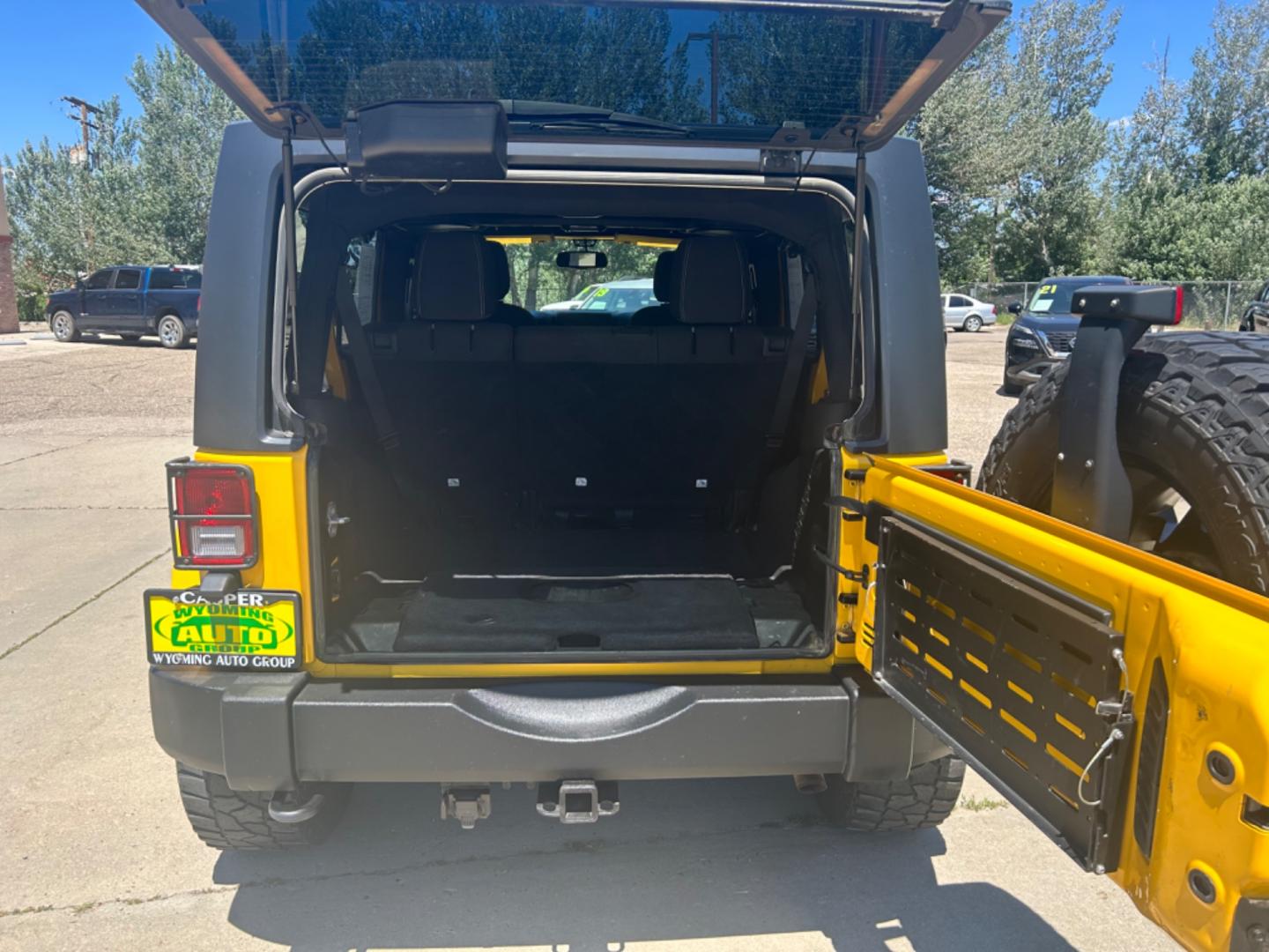 2015 YELLOW Jeep Wrangler Unlimited Sahara (1C4BJWEGXFL) with an V6, 3.6L engine, 6-Speed Manual transmission, located at 3030 CY Ave, Casper, WY, 82604, (307) 265-3830, 42.827816, -106.357483 - Get ready to conquer any terrain with this incredible 2015 Jeep Wrangler Unlimited Sahara! This rugged yet refined SUV is the perfect blend of power, style, and advanced technology, making it the ultimate adventure companion. Under the hood, you'll find a robust V6, 3.6L engine paired with a dependa - Photo#6