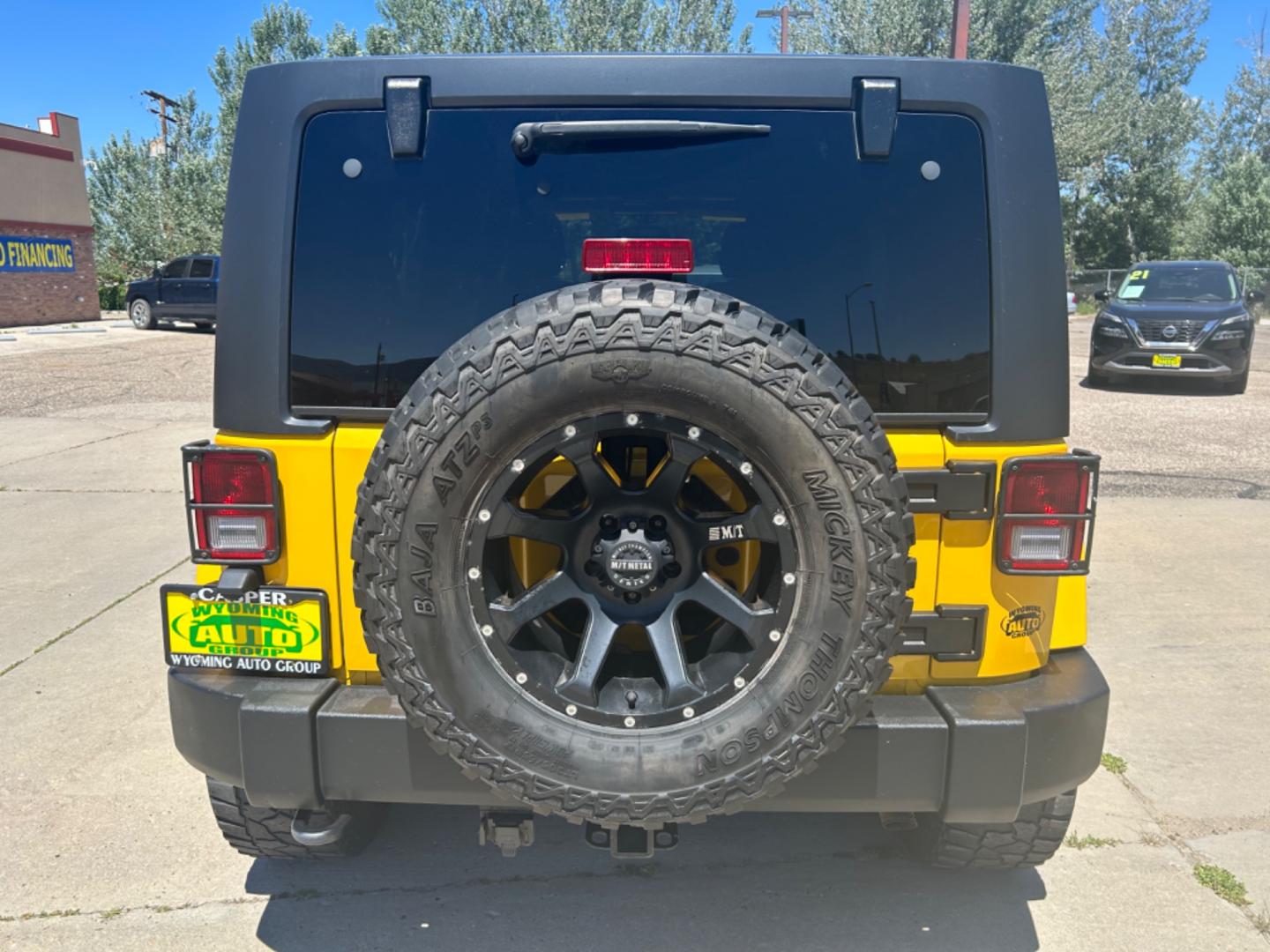 2015 YELLOW Jeep Wrangler Unlimited Sahara (1C4BJWEGXFL) with an V6, 3.6L engine, 6-Speed Manual transmission, located at 3030 CY Ave, Casper, WY, 82604, (307) 265-3830, 42.827816, -106.357483 - Get ready to conquer any terrain with this incredible 2015 Jeep Wrangler Unlimited Sahara! This rugged yet refined SUV is the perfect blend of power, style, and advanced technology, making it the ultimate adventure companion. Under the hood, you'll find a robust V6, 3.6L engine paired with a dependa - Photo#4