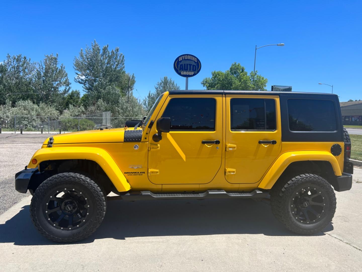 2015 YELLOW Jeep Wrangler Unlimited Sahara (1C4BJWEGXFL) with an V6, 3.6L engine, 6-Speed Manual transmission, located at 3030 CY Ave, Casper, WY, 82604, (307) 265-3830, 42.827816, -106.357483 - Get ready to conquer any terrain with this incredible 2015 Jeep Wrangler Unlimited Sahara! This rugged yet refined SUV is the perfect blend of power, style, and advanced technology, making it the ultimate adventure companion. Under the hood, you'll find a robust V6, 3.6L engine paired with a dependa - Photo#0