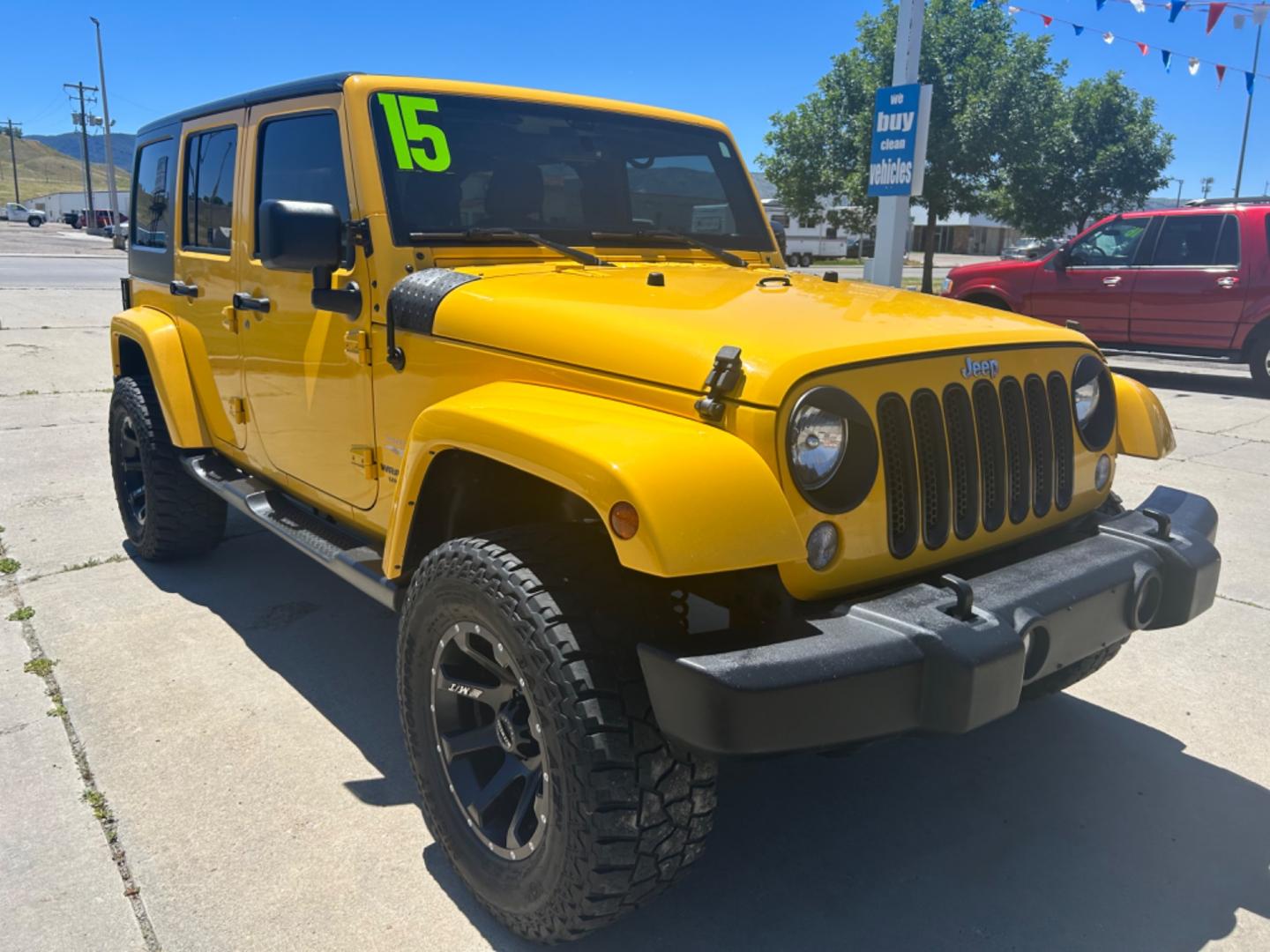 2015 YELLOW Jeep Wrangler Unlimited Sahara (1C4BJWEGXFL) with an V6, 3.6L engine, 6-Speed Manual transmission, located at 3030 CY Ave, Casper, WY, 82604, (307) 265-3830, 42.827816, -106.357483 - Photo#2