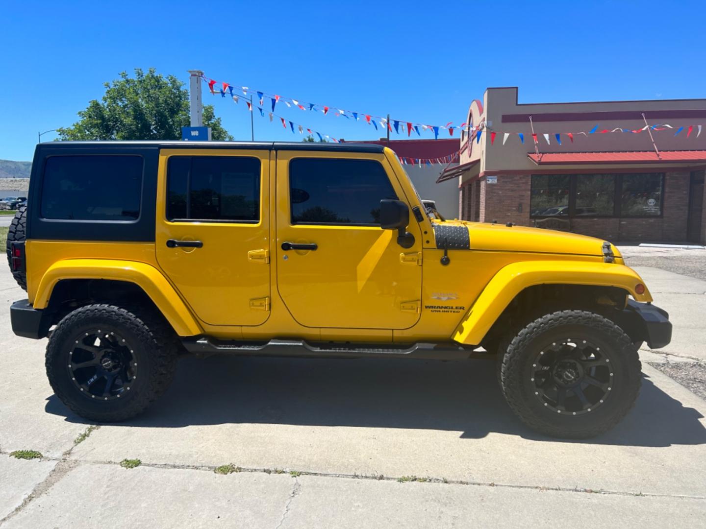 2015 YELLOW Jeep Wrangler Unlimited Sahara (1C4BJWEGXFL) with an V6, 3.6L engine, 6-Speed Manual transmission, located at 3030 CY Ave, Casper, WY, 82604, (307) 265-3830, 42.827816, -106.357483 - Get ready to conquer any terrain with this incredible 2015 Jeep Wrangler Unlimited Sahara! This rugged yet refined SUV is the perfect blend of power, style, and advanced technology, making it the ultimate adventure companion. Under the hood, you'll find a robust V6, 3.6L engine paired with a dependa - Photo#3