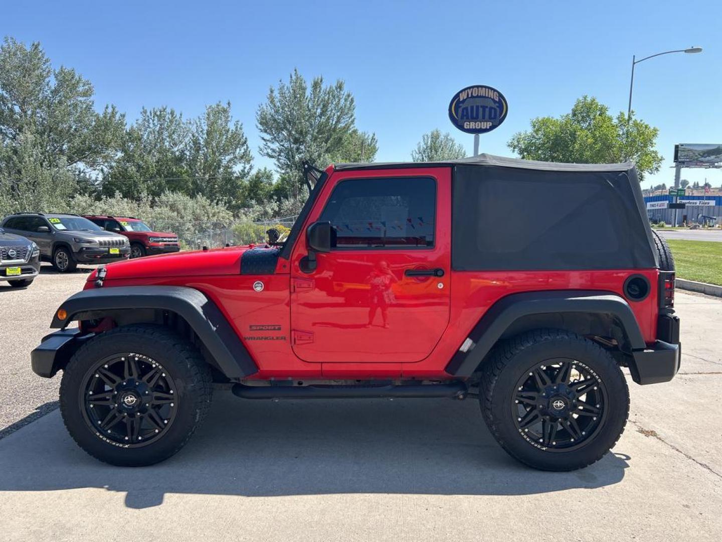 2016 red Jeep Wrangler sport (1C4AJWAG1GL) with an V6, 3.6L engine, Automatic transmission, located at 3030 CY Ave, Casper, WY, 82604, (307) 265-3830, 42.827816, -106.357483 - Photo#0