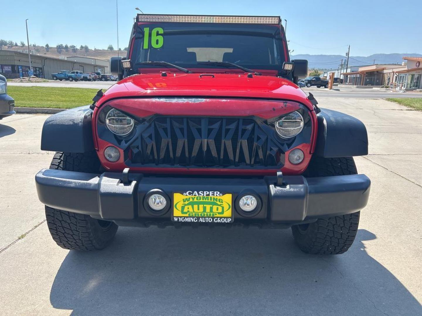 2016 red Jeep Wrangler sport (1C4AJWAG1GL) with an V6, 3.6L engine, Automatic transmission, located at 3030 CY Ave, Casper, WY, 82604, (307) 265-3830, 42.827816, -106.357483 - Photo#2