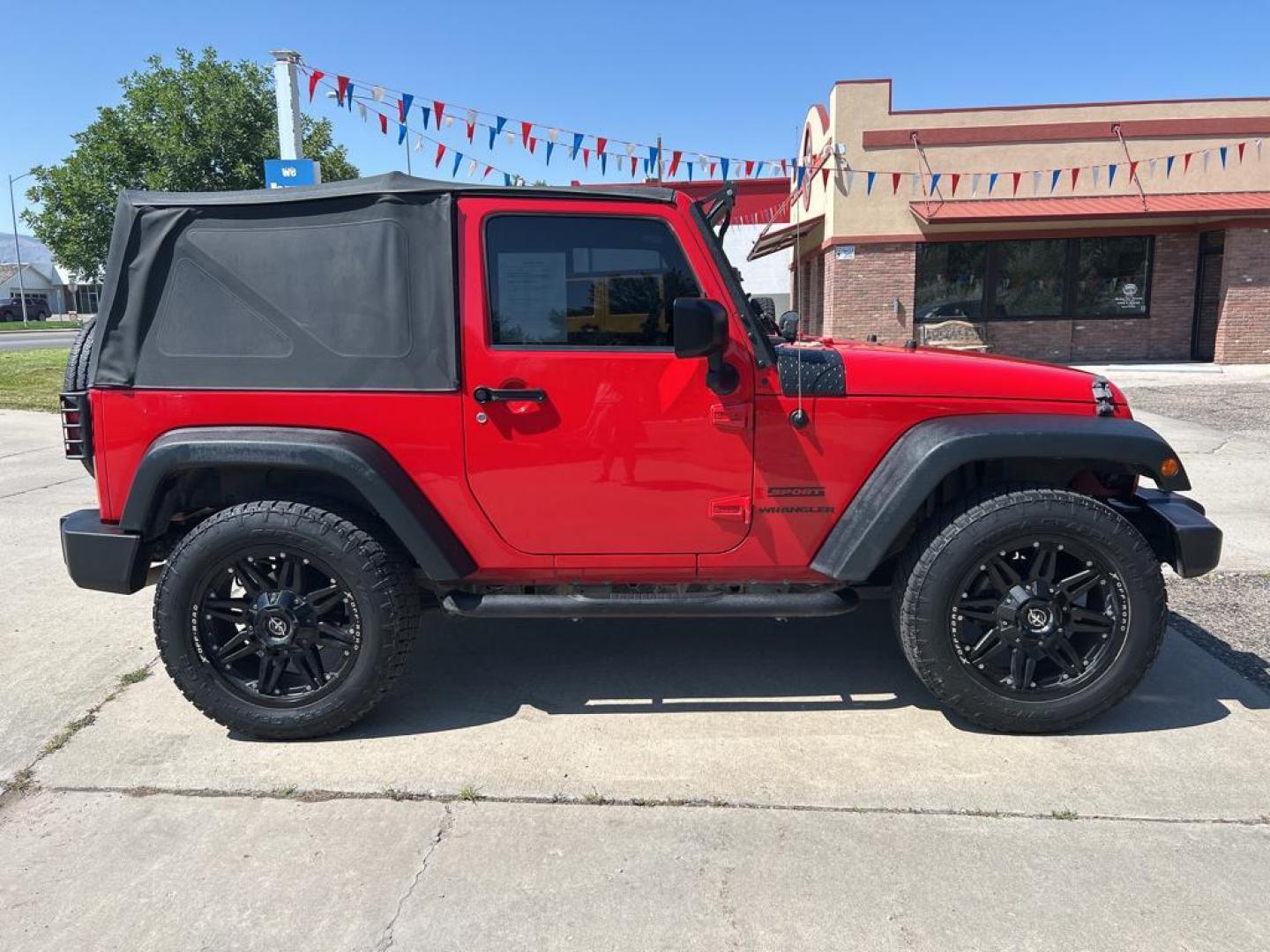 2016 red Jeep Wrangler sport (1C4AJWAG1GL) with an V6, 3.6L engine, Automatic transmission, located at 3030 CY Ave, Casper, WY, 82604, (307) 265-3830, 42.827816, -106.357483 - Photo#4