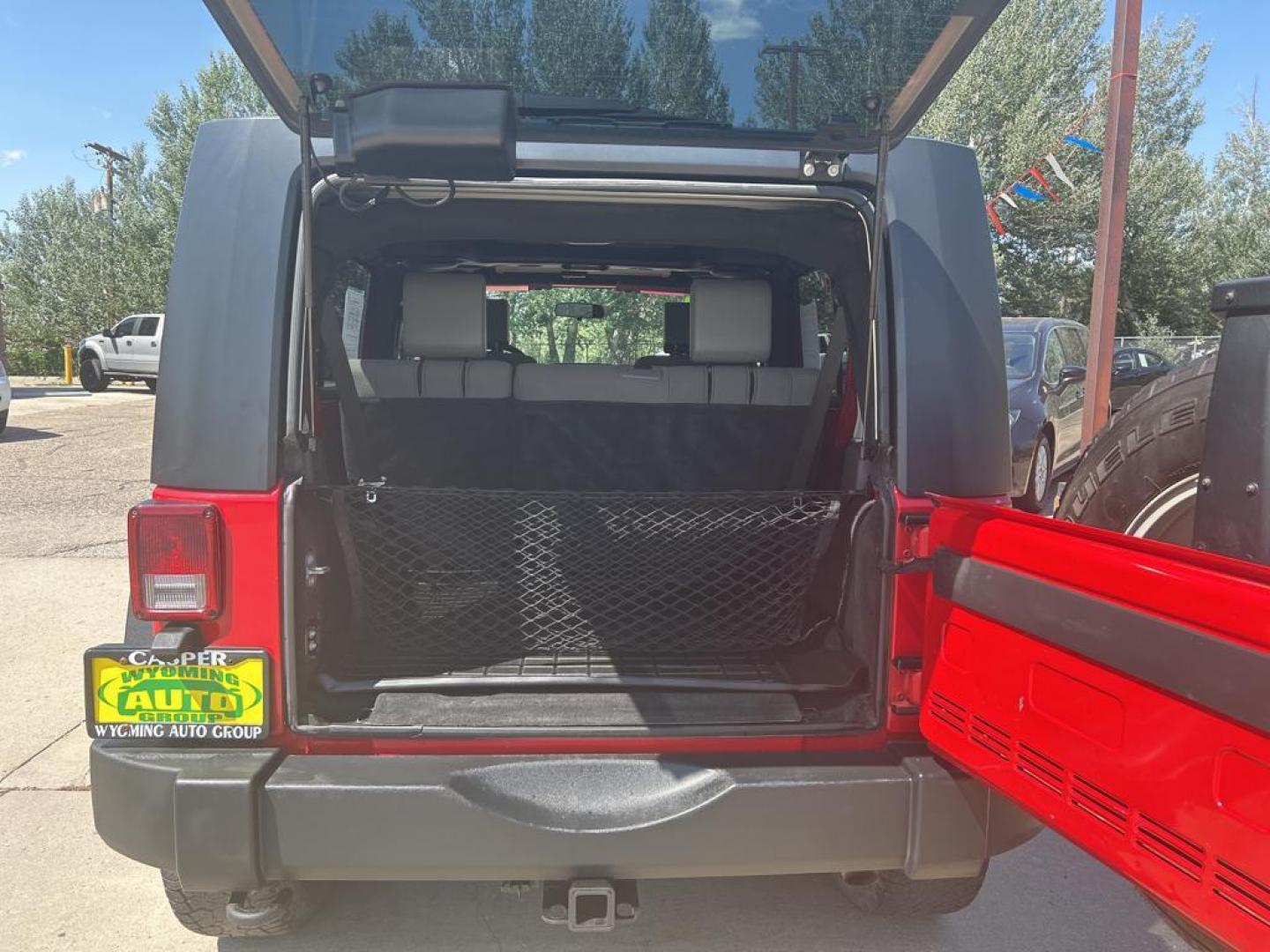 2010 red Jeep Wrangler Unlimited Sport (1J4BA3H11AL) with an V6, 3.8L engine, Manual transmission, located at 3030 CY Ave, Casper, WY, 82604, (307) 265-3830, 42.827816, -106.357483 - Photo#11