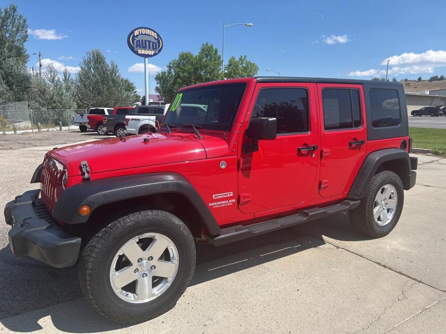 2010 red Jeep Wrangler Unlimited Sport (1J4BA3H11AL) with an V6, 3.8L engine, Manual transmission, located at 3030 CY Ave, Casper, WY, 82604, (307) 265-3830, 42.827816, -106.357483 - Photo#1