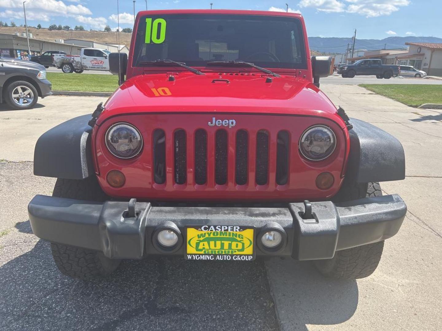 2010 red Jeep Wrangler Unlimited Sport (1J4BA3H11AL) with an V6, 3.8L engine, Manual transmission, located at 3030 CY Ave, Casper, WY, 82604, (307) 265-3830, 42.827816, -106.357483 - Photo#2