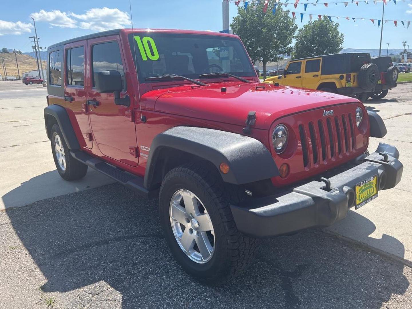 2010 red Jeep Wrangler Unlimited Sport (1J4BA3H11AL) with an V6, 3.8L engine, Manual transmission, located at 3030 CY Ave, Casper, WY, 82604, (307) 265-3830, 42.827816, -106.357483 - Photo#3