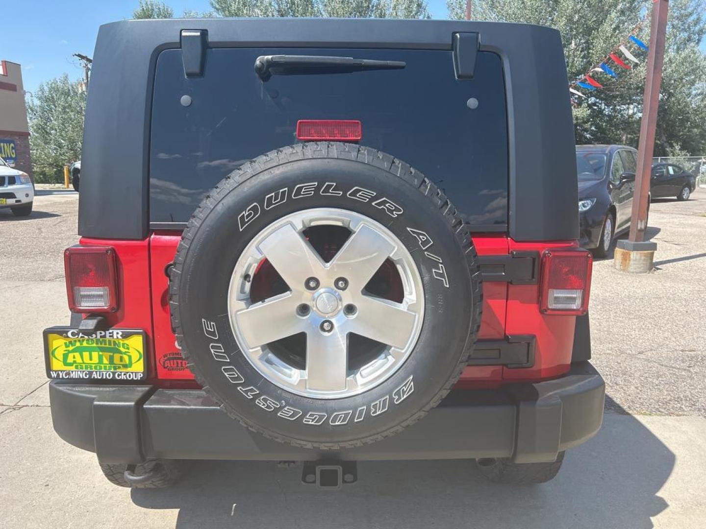 2010 red Jeep Wrangler Unlimited Sport (1J4BA3H11AL) with an V6, 3.8L engine, Manual transmission, located at 3030 CY Ave, Casper, WY, 82604, (307) 265-3830, 42.827816, -106.357483 - Photo#5