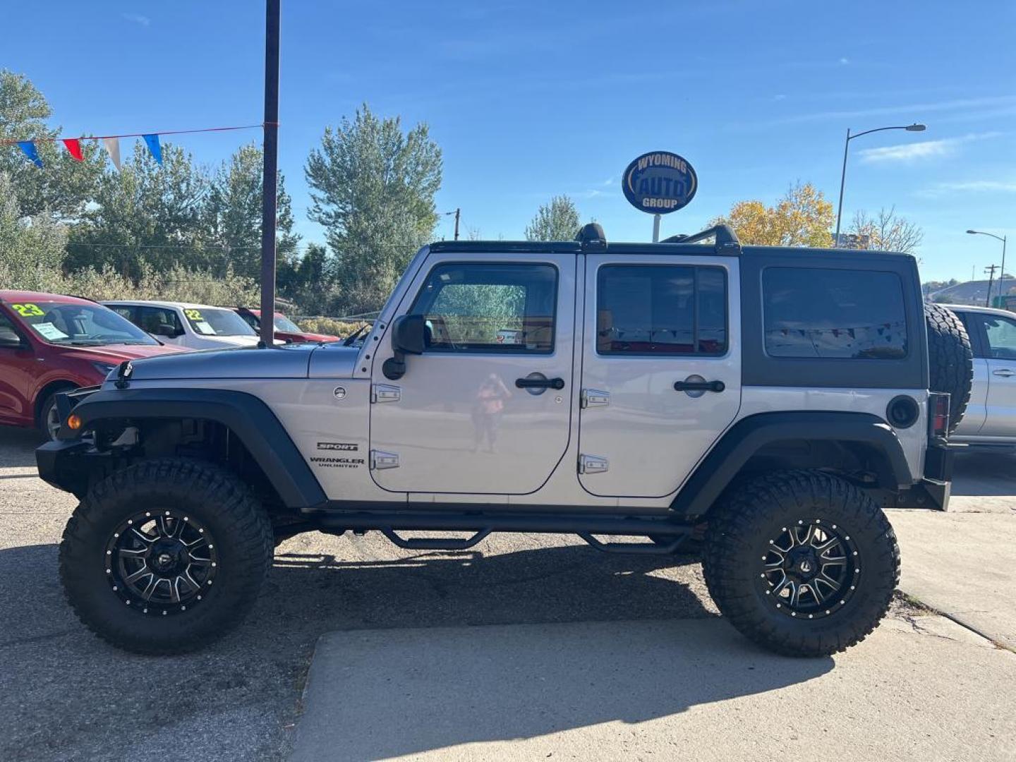 2015 silver Jeep Wrangler Unlimited Sport (1C4BJWDG4FL) with an V6, 3.6L engine, Automatic transmission, located at 3030 CY Ave, Casper, WY, 82604, (307) 265-3830, 42.827816, -106.357483 - For sale at our dealership is a robust and reliable 2015 Jeep Wrangler Unlimited Sport, perfect for those who crave adventure and off-road capability. This iconic SUV is equipped with a powerful V6, 3.6L engine and a dependable 4WD system, providing the performance you need for both city driving and - Photo#0