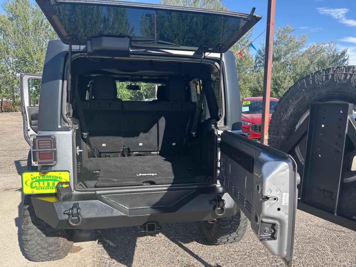 2015 silver Jeep Wrangler Unlimited Sport (1C4BJWDG4FL) with an V6, 3.6L engine, Automatic transmission, located at 3030 CY Ave, Casper, WY, 82604, (307) 265-3830, 42.827816, -106.357483 - For sale at our dealership is a robust and reliable 2015 Jeep Wrangler Unlimited Sport, perfect for those who crave adventure and off-road capability. This iconic SUV is equipped with a powerful V6, 3.6L engine and a dependable 4WD system, providing the performance you need for both city driving and - Photo#11