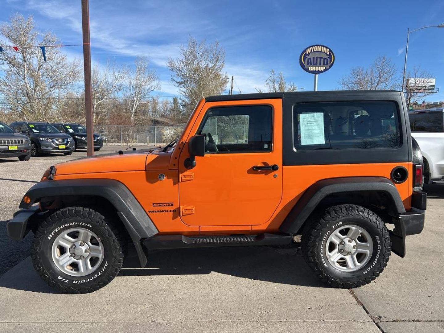 2012 orange Jeep Wrangler Sport (1C4AJWAG7CL) with an V6, 3.6L engine, Automatic transmission, located at 3030 CY Ave, Casper, WY, 82604, (307) 265-3830, 42.827816, -106.357483 - Photo#0