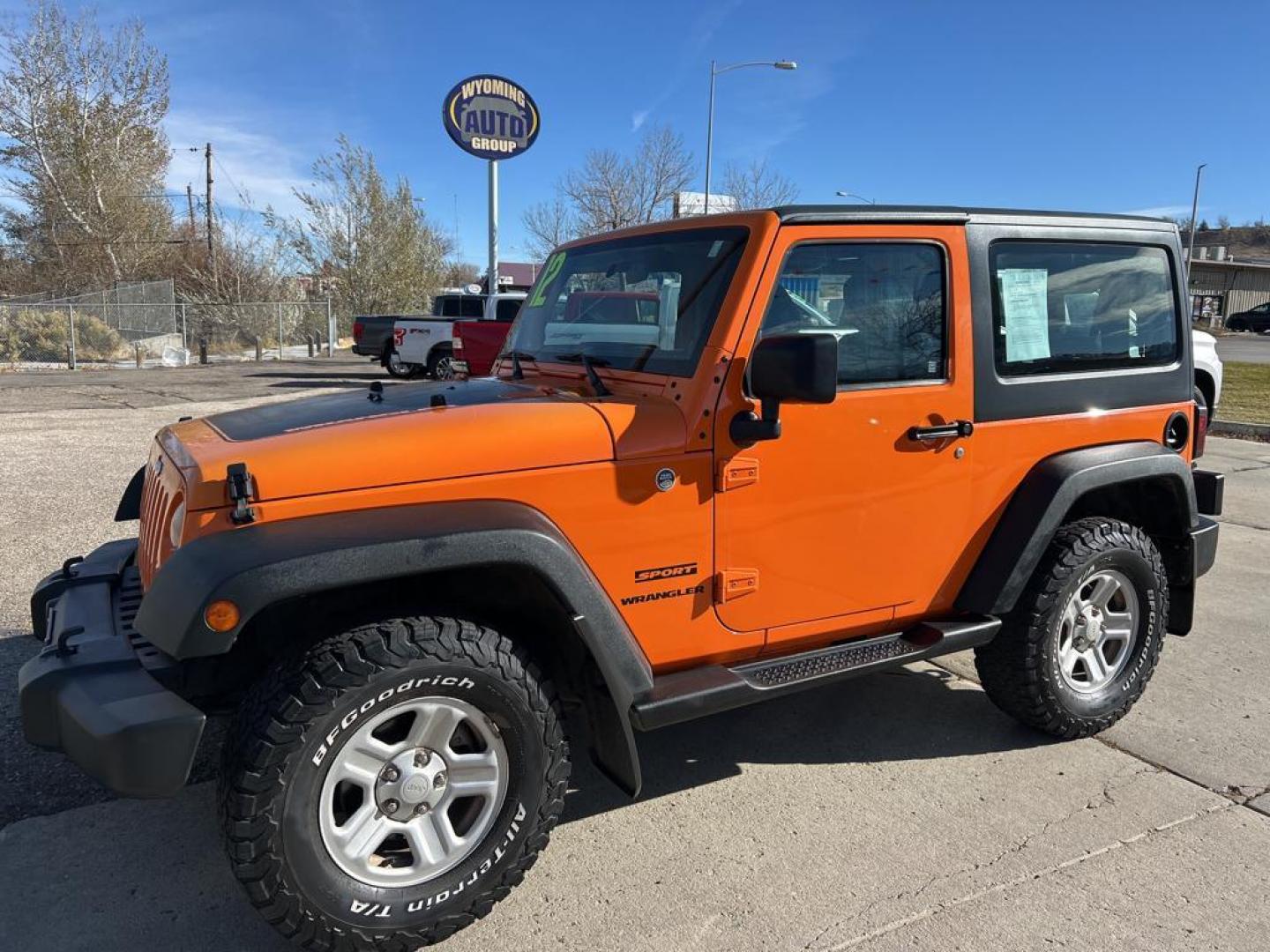 2012 orange Jeep Wrangler Sport (1C4AJWAG7CL) with an V6, 3.6L engine, Automatic transmission, located at 3030 CY Ave, Casper, WY, 82604, (307) 265-3830, 42.827816, -106.357483 - Photo#1