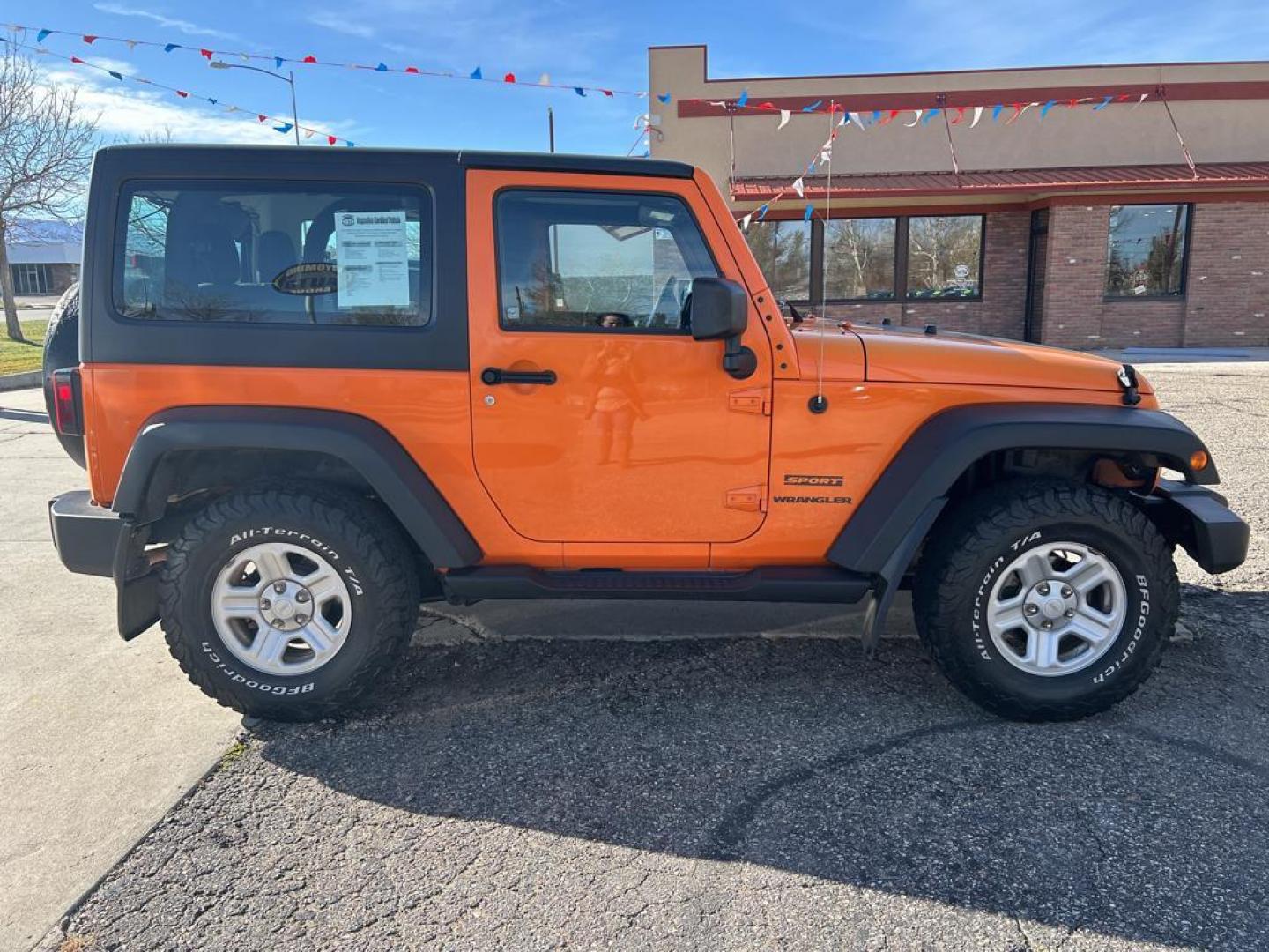 2012 orange Jeep Wrangler Sport (1C4AJWAG7CL) with an V6, 3.6L engine, Automatic transmission, located at 3030 CY Ave, Casper, WY, 82604, (307) 265-3830, 42.827816, -106.357483 - Photo#4