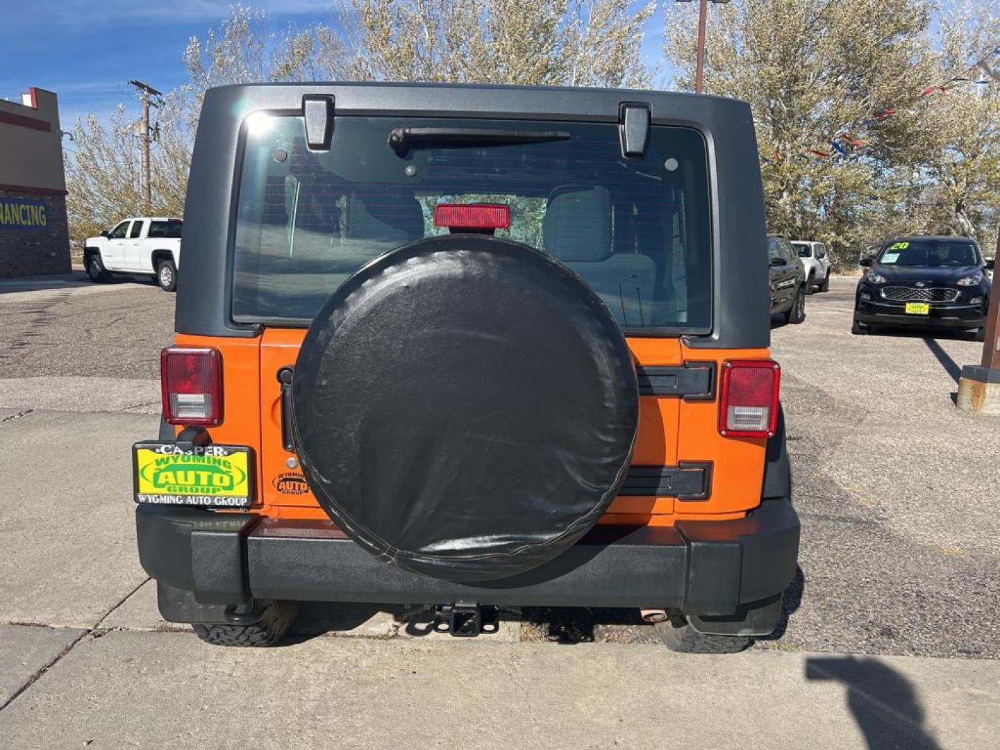 2012 orange Jeep Wrangler Sport (1C4AJWAG7CL) with an V6, 3.6L engine, Automatic transmission, located at 3030 CY Ave, Casper, WY, 82604, (307) 265-3830, 42.827816, -106.357483 - Photo#5