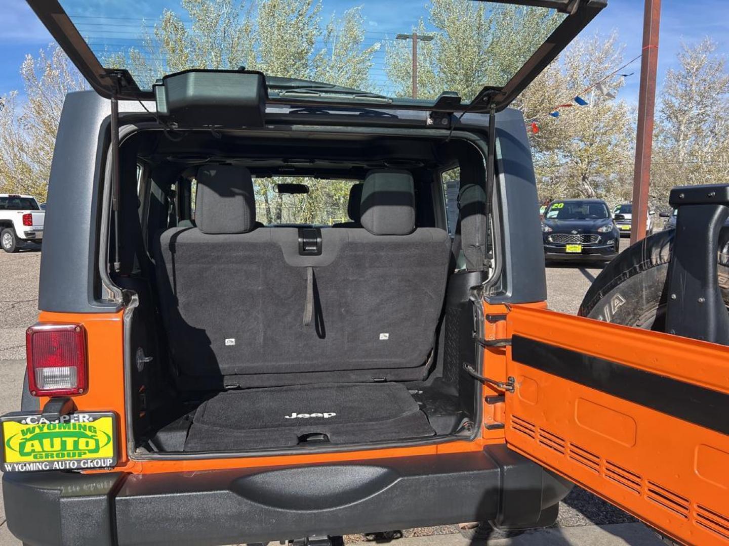 2012 orange Jeep Wrangler Sport (1C4AJWAG7CL) with an V6, 3.6L engine, Automatic transmission, located at 3030 CY Ave, Casper, WY, 82604, (307) 265-3830, 42.827816, -106.357483 - Photo#7