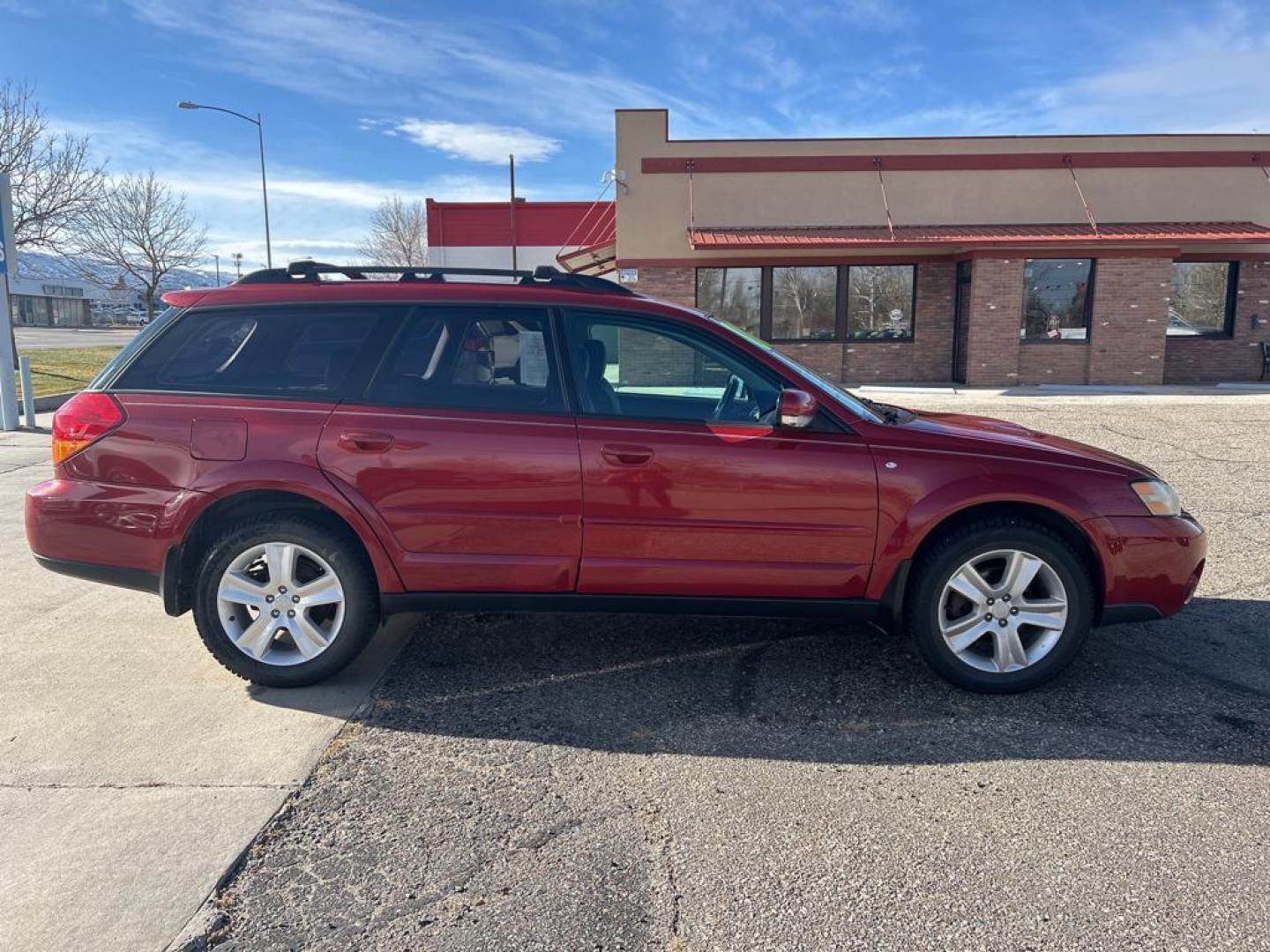 2006 maroon Subaru Outback XT Limited (4S4BP67C866) with an 4 Cyl, 2.5L engine, 5 Speed Manual transmission, located at 3030 CY Ave, Casper, WY, 82604, (307) 265-3830, 42.827816, -106.357483 - Photo#4