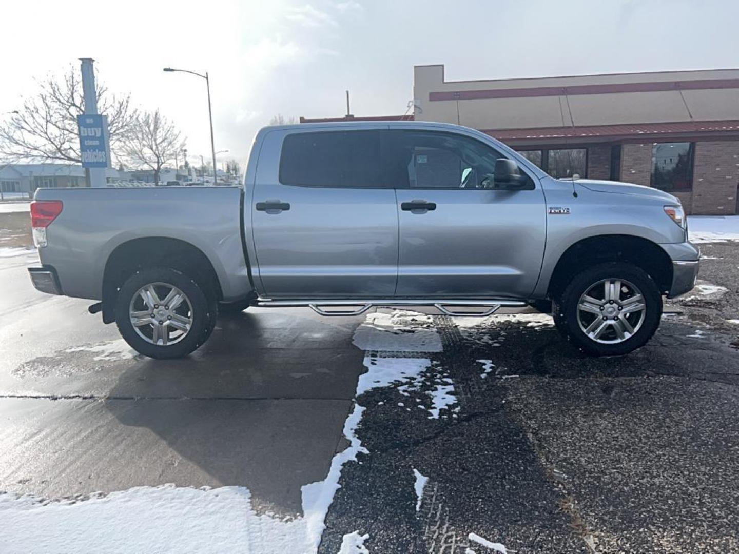 2013 silver Toyota Tundra GRADE (5TFDW5F16DX) with an V8, 5.7L engine, Automatic transmission, located at 3030 CY Ave, Casper, WY, 82604, (307) 265-3830, 42.827816, -106.357483 - Discover the rugged dependability of the 2013 Toyota Tundra, a robust full-size pickup truck that offers both power and versatility. This model, equipped with a formidable 4WD system and a V8, 5.7L engine, is engineered to handle demanding tasks with ease, making it an ideal choice for both work and - Photo#4