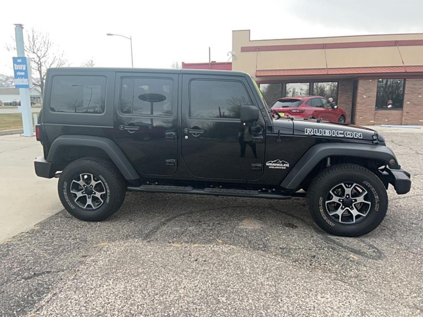 2013 black Jeep Wrangler Unlimited Rubicon (1C4HJWFG6DL) with an V6, 3.6L engine, Automatic transmission, located at 3030 CY Ave, Casper, WY, 82604, (307) 265-3830, 42.827816, -106.357483 - Photo#4