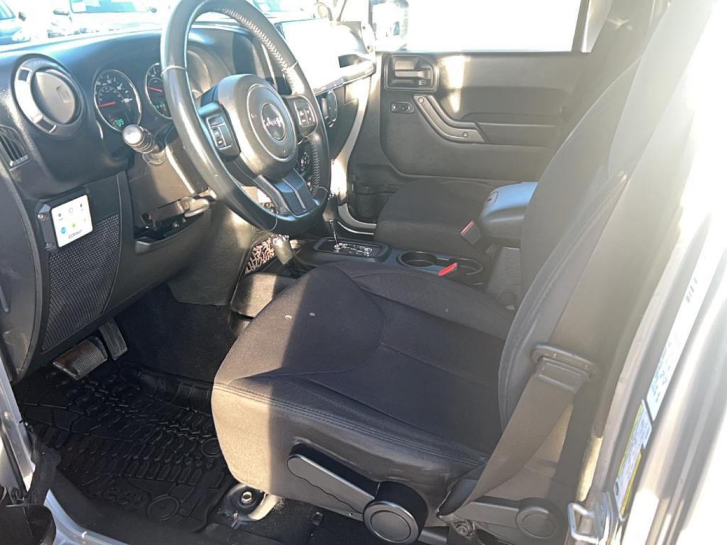 2014 gray Jeep Wrangler Unlimited Sport (1C4HJWDG1EL) with an V6, 3.6L engine, Automatic 6-Speed transmission, located at 3030 CY Ave, Casper, WY, 82604, (307) 265-3830, 42.827816, -106.357483 - Photo#6