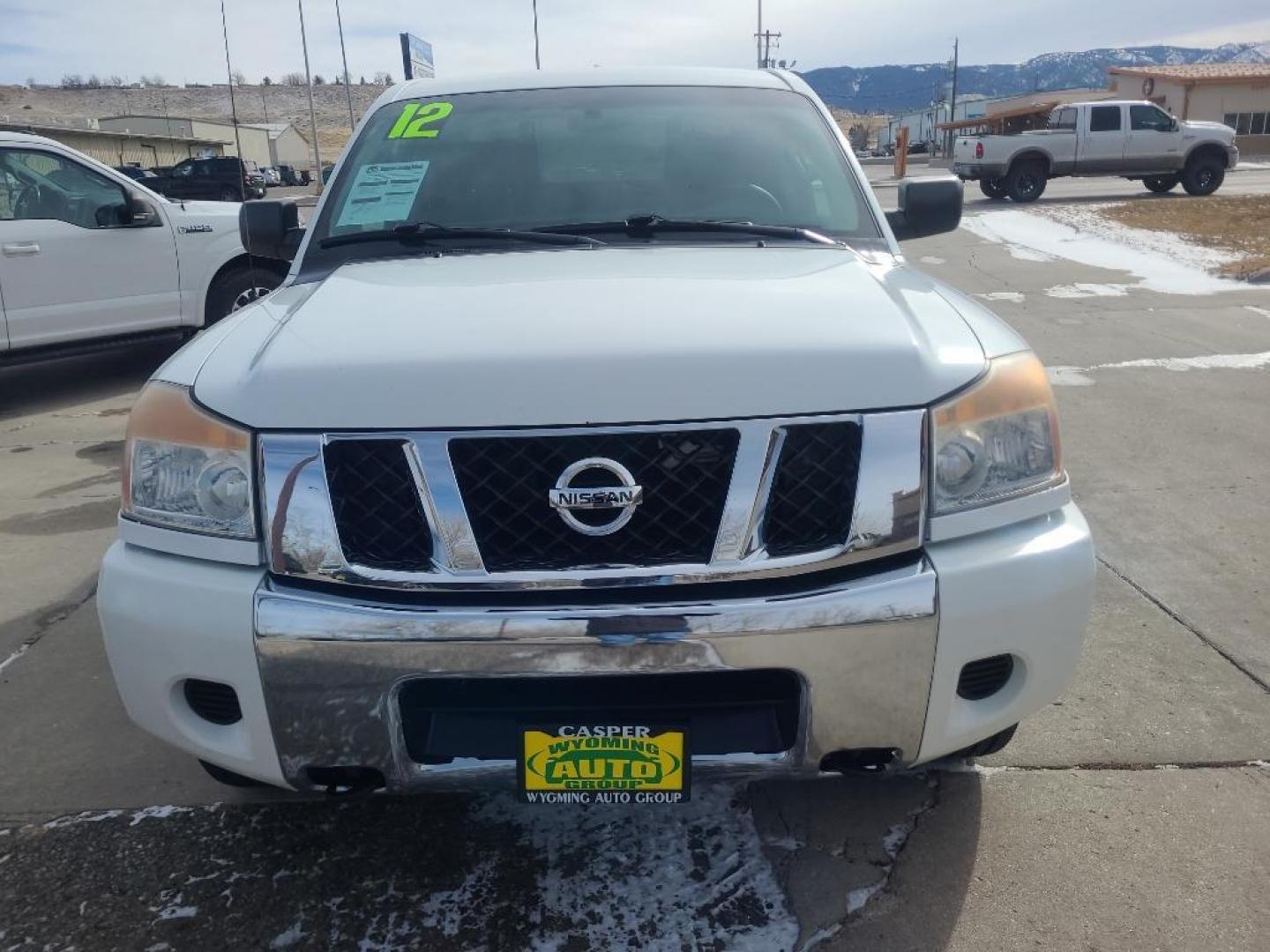 2012 WHITE Nissan Titan SV (1N6AA0EJ6CN) with an V8, 5.6L engine, Automatic transmission, located at 3030 CY Ave, Casper, WY, 82604, (307) 265-3830, 42.827816, -106.357483 - Extra clean , low mileage, local trade in. Looks and runs great! V8 power! 4WD! - Photo#1