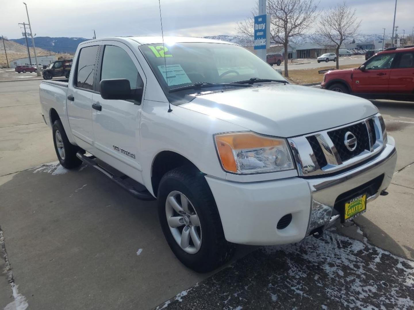 2012 WHITE Nissan Titan SV (1N6AA0EJ6CN) with an V8, 5.6L engine, Automatic transmission, located at 3030 CY Ave, Casper, WY, 82604, (307) 265-3830, 42.827816, -106.357483 - Extra clean , low mileage, local trade in. Looks and runs great! V8 power! 4WD! - Photo#2