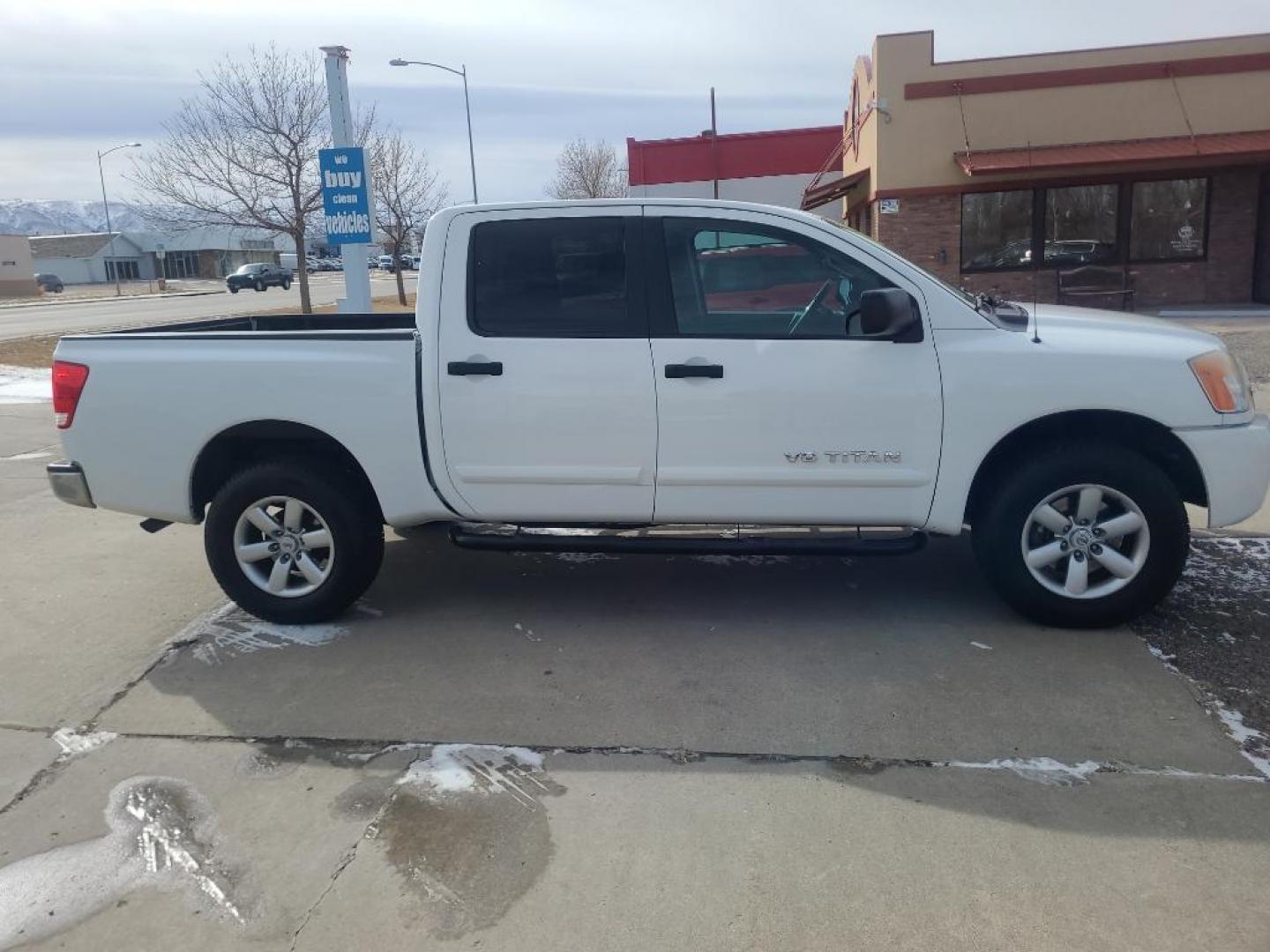 2012 WHITE Nissan Titan SV (1N6AA0EJ6CN) with an V8, 5.6L engine, Automatic transmission, located at 3030 CY Ave, Casper, WY, 82604, (307) 265-3830, 42.827816, -106.357483 - Extra clean , low mileage, local trade in. Looks and runs great! V8 power! 4WD! - Photo#3