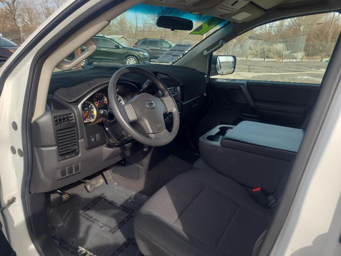 2012 WHITE Nissan Titan SV (1N6AA0EJ6CN) with an V8, 5.6L engine, Automatic transmission, located at 3030 CY Ave, Casper, WY, 82604, (307) 265-3830, 42.827816, -106.357483 - Extra clean , low mileage, local trade in. Looks and runs great! V8 power! 4WD! - Photo#5