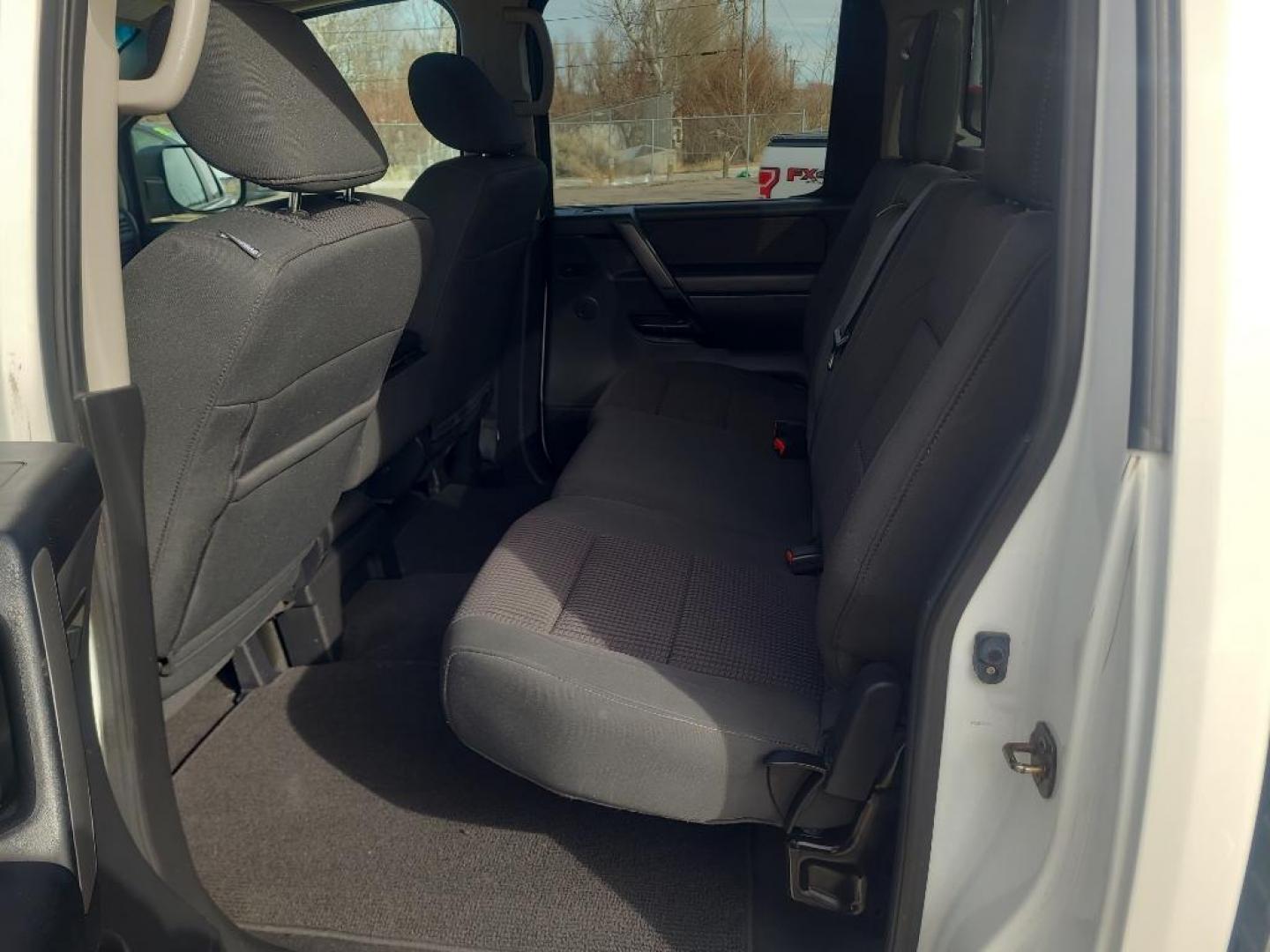 2012 WHITE Nissan Titan SV (1N6AA0EJ6CN) with an V8, 5.6L engine, Automatic transmission, located at 3030 CY Ave, Casper, WY, 82604, (307) 265-3830, 42.827816, -106.357483 - Extra clean , low mileage, local trade in. Looks and runs great! V8 power! 4WD! - Photo#6